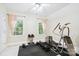 Bright exercise room featuring weights and an elliptical machine with views of the landscape outside at 6795 Montgomery Rd, Lake Wylie, SC 29710