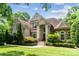Stunning two-story brick home with a manicured lawn and lush landscaping creates great curb appeal at 6795 Montgomery Rd, Lake Wylie, SC 29710