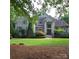 Charming two-story brick home with manicured lawn and lush landscaping at 6795 Montgomery Rd, Lake Wylie, SC 29710