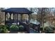 Wooden gazebo by the lake with view of the water and lots of surrounding greenery at 6795 Montgomery Rd, Lake Wylie, SC 29710