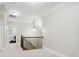 Upstairs hallway with chandelier and wrought iron railing at 6795 Montgomery Rd, Lake Wylie, SC 29710