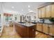 Spacious kitchen featuring a large island, granite countertops, and stainless steel appliances at 6795 Montgomery Rd, Lake Wylie, SC 29710