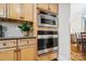 Built-in stainless steel microwave and oven enhance the kitchen's modern look at 6795 Montgomery Rd, Lake Wylie, SC 29710