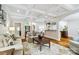 Living room with coffered ceilings, hardwood floors, and a view into the kitchen and entryway at 6795 Montgomery Rd, Lake Wylie, SC 29710