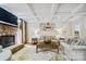 Inviting living room with hardwood floors, coffered ceilings, and stone fireplace creating a cozy gathering space at 6795 Montgomery Rd, Lake Wylie, SC 29710