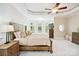 This primary bedroom boasts a tray ceiling, bay windows, and warm neutral tones throughout at 6795 Montgomery Rd, Lake Wylie, SC 29710