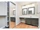 Vanity area featuring double sinks, white countertops, and mirrored sliding closet door at 7123 Meeting St, Charlotte, NC 28210