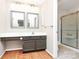 Bright bathroom with a sink vanity and a shower at 7123 Meeting St, Charlotte, NC 28210