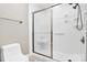 Bathroom featuring a walk-in shower with sliding glass doors and tile flooring at 7123 Meeting St, Charlotte, NC 28210