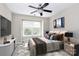 Cozy bedroom with a ceiling fan, bright window, and tastefully decorated at 7123 Meeting St, Charlotte, NC 28210