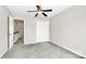 Neutral bedroom features carpet flooring, a ceiling fan, and a closet at 7123 Meeting St, Charlotte, NC 28210