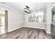 Dining room features a mirrored wall, chandelier lighting, and an open layout with easy access to other spaces at 7123 Meeting St, Charlotte, NC 28210