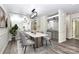 Stylish dining room with modern light fixture, decorative mirror, and a serving bar area at 7123 Meeting St, Charlotte, NC 28210