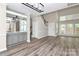 The home's design merges dining and living with a wet bar and an adjacent staircase, creating a cohesive, welcoming space at 7123 Meeting St, Charlotte, NC 28210