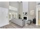 Bright living room featuring a tall fireplace, large windows, and neutral decor at 7123 Meeting St, Charlotte, NC 28210