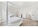 Bright, airy bedroom featuring a four-poster bed and a view of a closet at 7160 Sumters Camp Trl, Indian Land, SC 29707