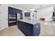 This modern kitchen features navy cabinets, stainless steel appliances, and a large center island at 7160 Sumters Camp Trl, Indian Land, SC 29707