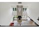 Spacious living room with high ceilings, large windows, stone fireplace, and modern chandelier at 7160 Sumters Camp Trl, Indian Land, SC 29707