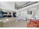 Open-concept living room with a view of the kitchen, featuring an impressive fireplace and high ceilings at 7160 Sumters Camp Trl, Indian Land, SC 29707