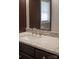 Close-up of a bathroom sink with granite countertop, stainless steel faucet, and dark cabinets at 728 Morningside Dr, Mount Holly, NC 28120
