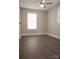 This bedroom offers hardwood floors, neutral walls, a ceiling fan, and ample natural light at 728 Morningside Dr, Mount Holly, NC 28120