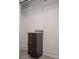 Custom closet featuring granite countertops and a cabinet for optimal storage at 728 Morningside Dr, Mount Holly, NC 28120