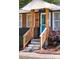 Close-up of a charming front porch with wooden railings and a stylish front door at 728 Morningside Dr, Mount Holly, NC 28120