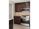 Modern kitchen with stainless steel appliances and dark cabinetry at 728 Morningside Dr, Mount Holly, NC 28120