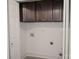 Well-organized laundry room with cabinetry, clean white walls and modern utility connections at 728 Morningside Dr, Mount Holly, NC 28120