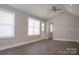 Bright and airy living room with vaulted ceiling, hardwood floors, and ample natural light at 728 Morningside Dr, Mount Holly, NC 28120