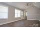 Open-concept living room with hardwood floors and natural lighting at 728 Morningside Dr, Mount Holly, NC 28120