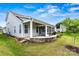 Charming home exterior with a screened porch, patio, and well-kept lawn at 7362 Overjoyed Xing, Charlotte, NC 28215
