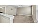 Upstairs bonus room with neutral carpet and plenty of natural light at 7362 Overjoyed Xing, Charlotte, NC 28215