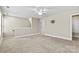 Spacious bonus room with neutral carpet, ceiling fan, and a bathroom with shower at 7362 Overjoyed Xing, Charlotte, NC 28215