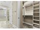 Walk-in closet with extensive built-in shelving at 7362 Overjoyed Xing, Charlotte, NC 28215