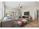 Bright, open living space with hardwood floors and comfortable seating, adjacent to the dining and kitchen area at 7362 Overjoyed Xing, Charlotte, NC 28215