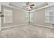 Spacious main bedroom features large windows for natural light and a tray ceiling at 7362 Overjoyed Xing, Charlotte, NC 28215