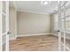 Sun-filled office space with hardwood floors, crown molding, and french doors at 7362 Overjoyed Xing, Charlotte, NC 28215