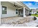 Charming outdoor patio with stone flooring, screened porch and comfortable seating at 7362 Overjoyed Xing, Charlotte, NC 28215
