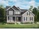 Beautiful two-story home with a stone and dark siding exterior, and a well-maintained lawn and colorful flowers at 7513 Lancaster Hwy # 6, Waxhaw, NC 28173