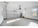 Spacious two-car garage with high ceilings and natural light at 7513 Lancaster Hwy # 6, Waxhaw, NC 28173