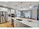 Well-lit kitchen featuring stainless steel appliances and an island with sink at 7513 Lancaster Hwy # 6, Waxhaw, NC 28173