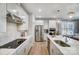 Modern kitchen with stainless steel appliances, white countertops, and ample cabinet space at 7513 Lancaster Hwy # 6, Waxhaw, NC 28173