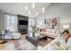 Elegant living room with fireplace, modern lighting, and stylish furnishings at 7513 Lancaster Hwy # 6, Waxhaw, NC 28173