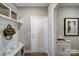 Well-organized mudroom with built-in storage, hooks, and a utility sink at 7513 Lancaster Hwy # 6, Waxhaw, NC 28173