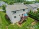 A lush backyard with a deck and fenced area offers a private outdoor retreat at 7650 W Berkeley Rd, Denver, NC 28037
