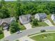 An aerial view showcases a desirable neighborhood with tree-lined streets and well-maintained homes at 7650 W Berkeley Rd, Denver, NC 28037