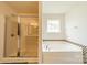 Elegant bathroom with a glass-enclosed shower and a separate soaking tub at 7650 W Berkeley Rd, Denver, NC 28037