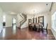 An inviting dining area features gleaming hardwood floors, ample natural light, and stylish décor at 7650 W Berkeley Rd, Denver, NC 28037