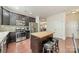 Well-lit kitchen features stainless steel appliances, butcher block island, and dark wood cabinets at 7650 W Berkeley Rd, Denver, NC 28037